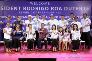 President Rodrigo Roa Duterte strikes his signature pose with the officers of the Alsons Consolidated Resources Inc. during the inauguration of the 105-Megawatt Coal-Fired Power Plant Phase 2 of Sarangani Energy Corporation and the launch of the 14.5-Megawatt Hydropower Project of Siguil Hydro Power Corporation in Maasim, Sarangani Province on November 22, 2019. SIMEON CELI JR./PRESIDENTIAL PHOTO