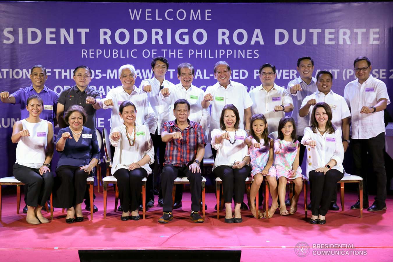 President Rodrigo Roa Duterte strikes his signature pose with the officers of the Alsons Consolidated Resources Inc. during the inauguration of the 105-Megawatt Coal-Fired Power Plant Phase 2 of Sarangani Energy Corporation and the launch of the 14.5-Megawatt Hydropower Project of Siguil Hydro Power Corporation in Maasim, Sarangani Province on November 22, 2019. SIMEON CELI JR./PRESIDENTIAL PHOTO