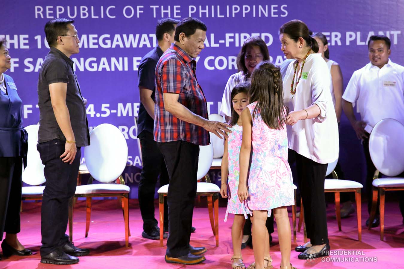 President Rodrigo Roa Duterte shares a light moment with some of the children in attendance during the inauguration of the 105-Megawatt Coal-Fired Power Plant Phase 2 of Sarangani Energy Corporation and the launch of the 14.5-Megawatt Hydropower Project of Siguil Hydro Power Corporation in Maasim, Sarangani Province on November 22, 2019. SIMEON CELI JR./PRESIDENTIAL PHOTO