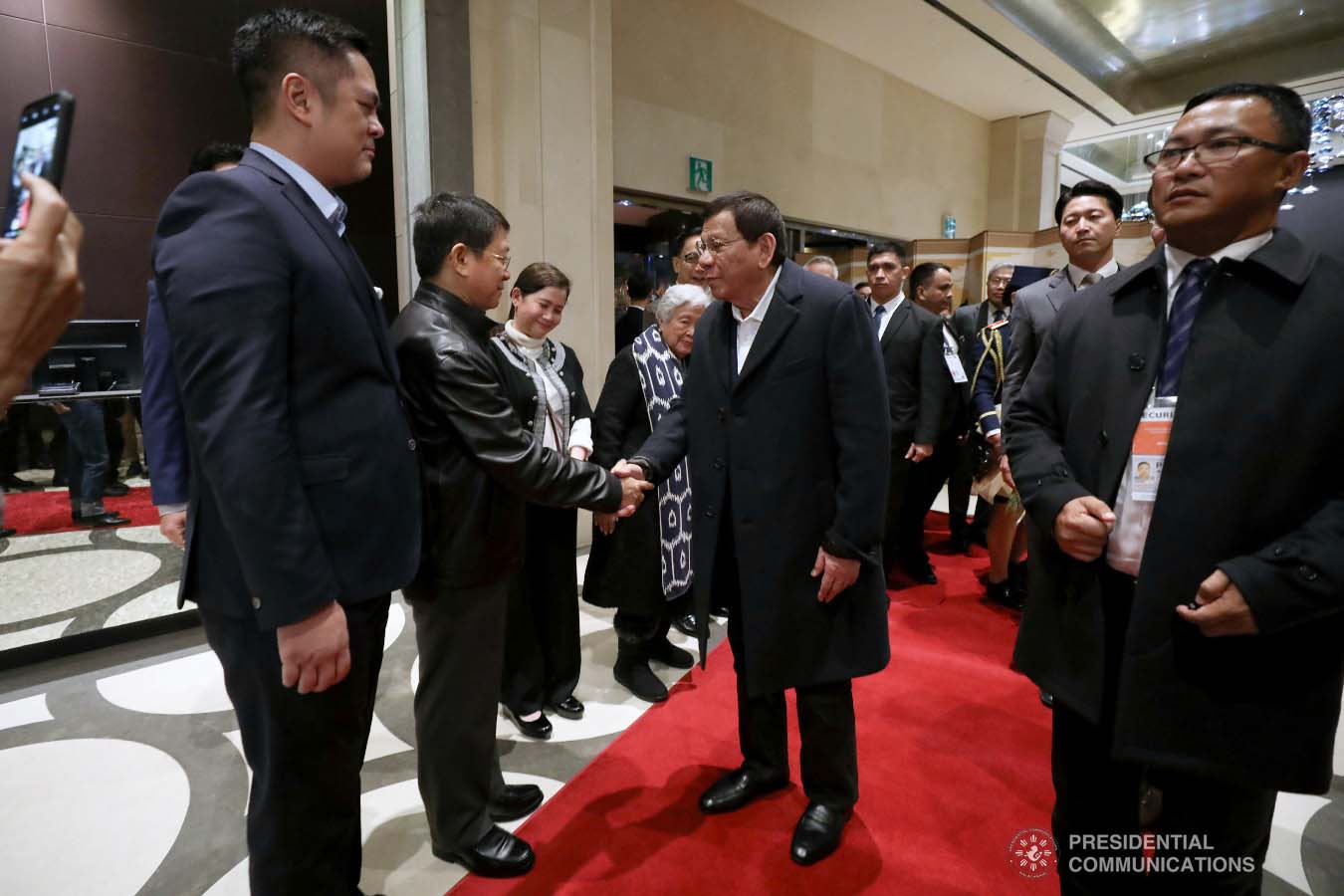President Rodrigo Roa Duterte is welcomed by Interior and Local Government Secretary Eduardo Año and other members of the Philippine delegation upon his arrival at a hotel in Busan, Republic of Korea on November 25, 2019. ROBINSON NIÑAL JR./PRESIDENTIAL PHOTO