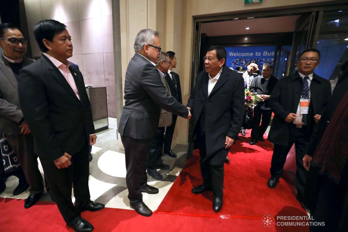President Rodrigo Roa Duterte is welcomed by Trade and Industry Secretary Ramon Lopez and other members of the Philippine delegation upon his arrival at a hotel in Busan, Republic of Korea on November 25, 2019. ROBINSON NIÑAL JR./PRESIDENTIAL PHOTO