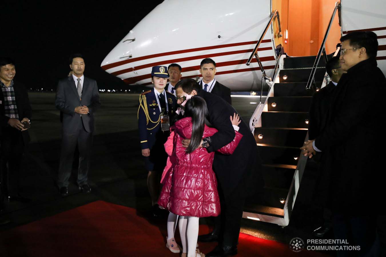 President Rodrigo Roa Duterte embraces the children who are part of the reception party upon his arrival at the Gimhae Air Base in Busan, Republic of Korea on November 25, 2019. KARL NORMAN ALONZO/PRESIDENTIAL PHOTO