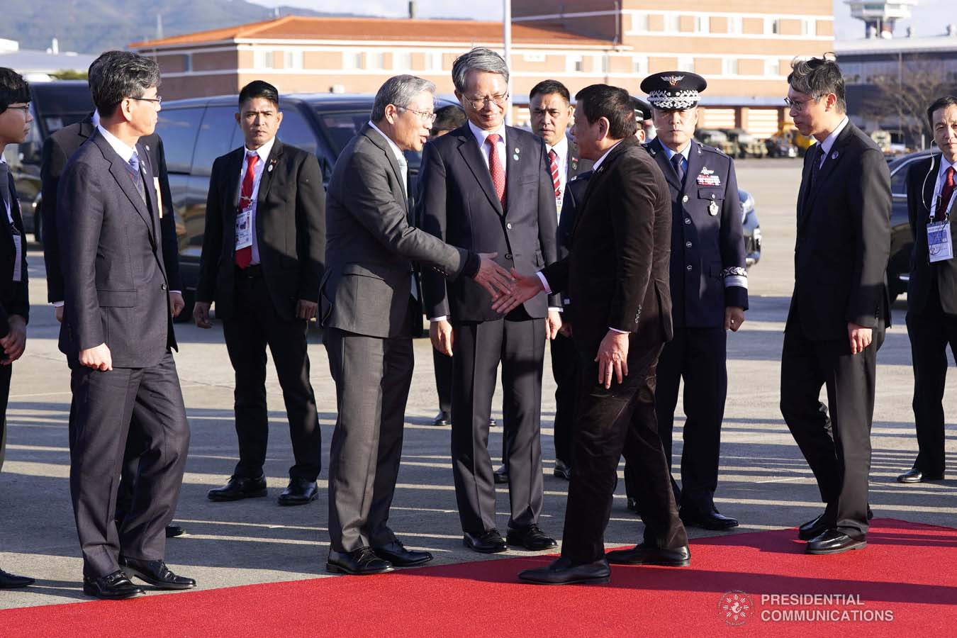 President Rodrigo Roa Duterte bids farewell to the members of the send-off party as he prepares to depart for Manila at the Gimhae Air Base in Busan, Republic of Korea on November 26, 2019. ARMAN BAYLON/PRESIDENTIAL PHOTO