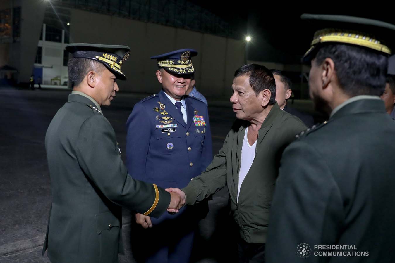President Rodrigo Roa Duterte is welcomed by a military officer upon his arrival at the Villamor Air Base in Pasay City on November 26, 2019 after his successful participation in the Association of Southeast Asian Nations (ASEAN)-Republic of Korea Commemorative Summit in Busan. ALFRED FRIAS/PRESIDENTIAL PHOTO