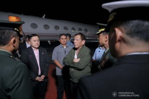 President Rodrigo Roa Duterte chats with military officers upon his arrival at the Villamor Air Base in Pasay City on November 26, 2019 after his successful participation in the Association of Southeast Asian Nations (ASEAN)-Republic of Korea Commemorative Summit in Busan. ALFRED FRIAS/PRESIDENTIAL PHOTO