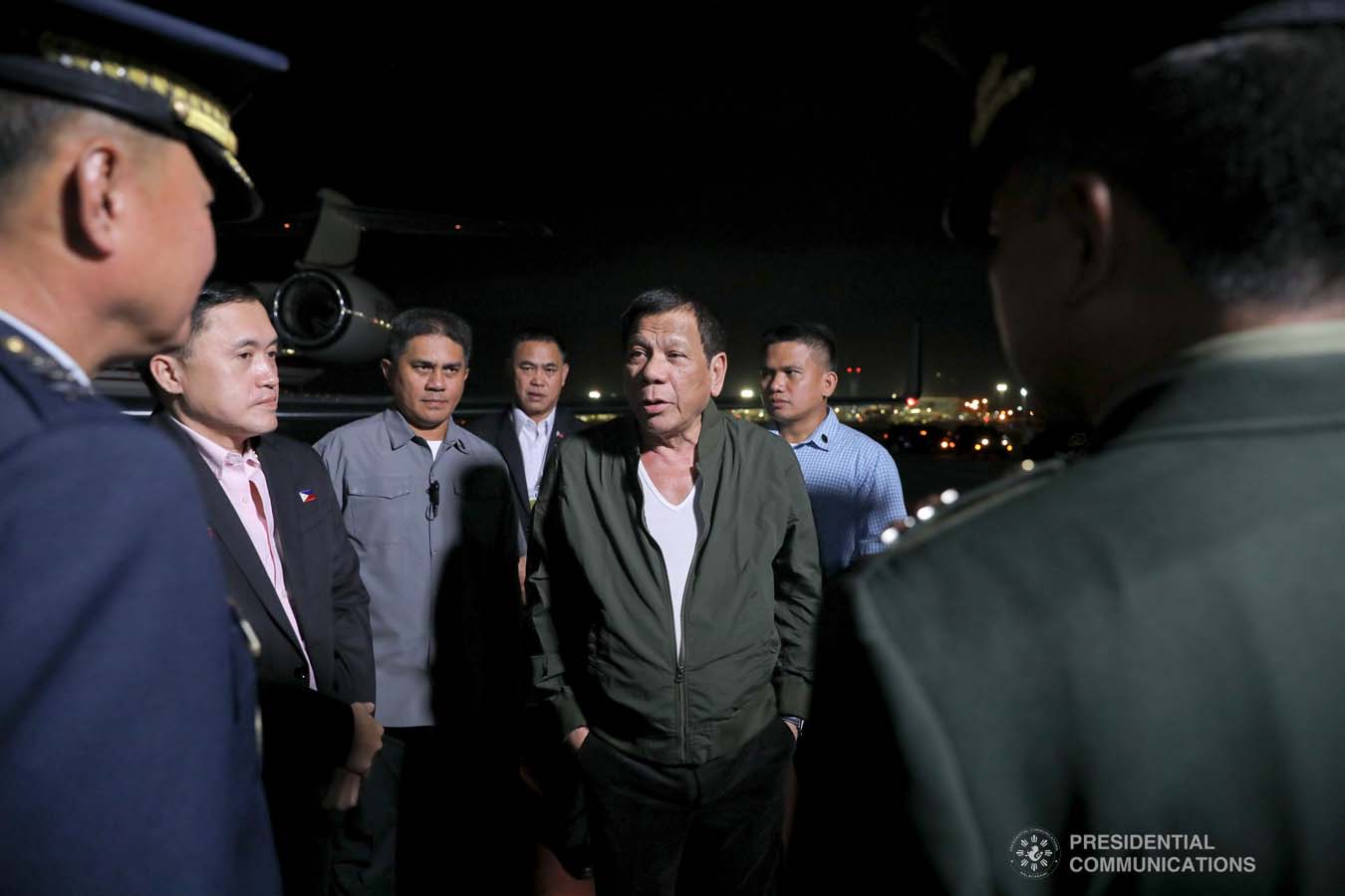 President Rodrigo Roa Duterte chats with military officers upon his arrival at the Villamor Air Base in Pasay City on November 26, 2019 after his successful participation in the Association of Southeast Asian Nations (ASEAN)-Republic of Korea Commemorative Summit in Busan. ALFRED FRIAS/PRESIDENTIAL PHOTO