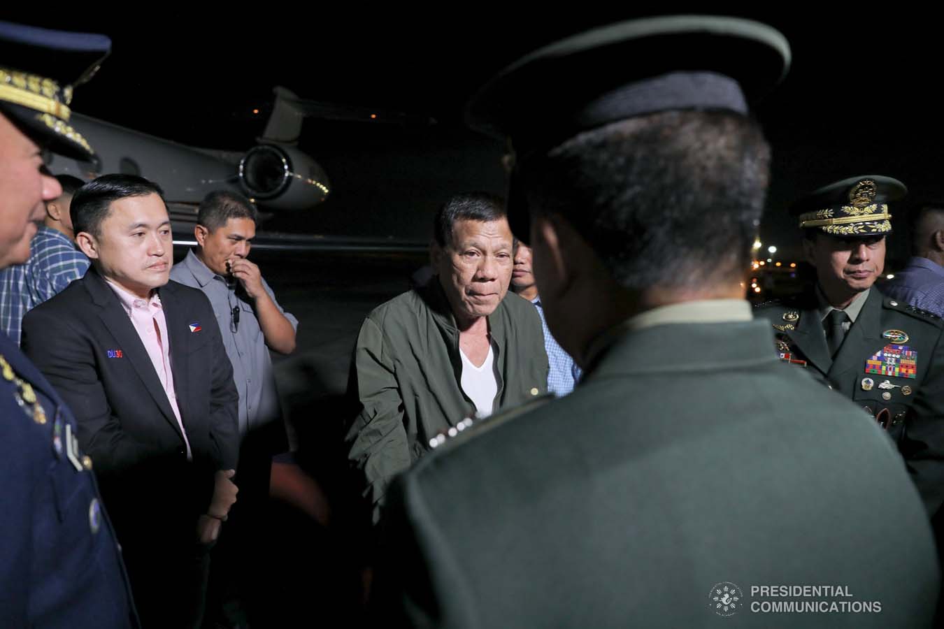 President Rodrigo Roa Duterte is welcomed by a military officer upon his arrival at the Villamor Air Base in Pasay City on November 26, 2019 after his successful participation in the Association of Southeast Asian Nations (ASEAN)-Republic of Korea Commemorative Summit in Busan. ALFRED FRIAS/PRESIDENTIAL PHOTO