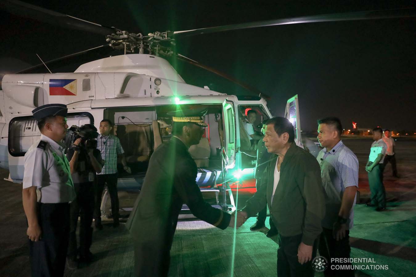 President Rodrigo Roa Duterte is welcomed by a military officer upon his arrival at the Villamor Air Base in Pasay City on November 26, 2019 after his successful participation in the Association of Southeast Asian Nations (ASEAN)-Republic of Korea Commemorative Summit in Busan. ALFRED FRIAS/PRESIDENTIAL PHOTO