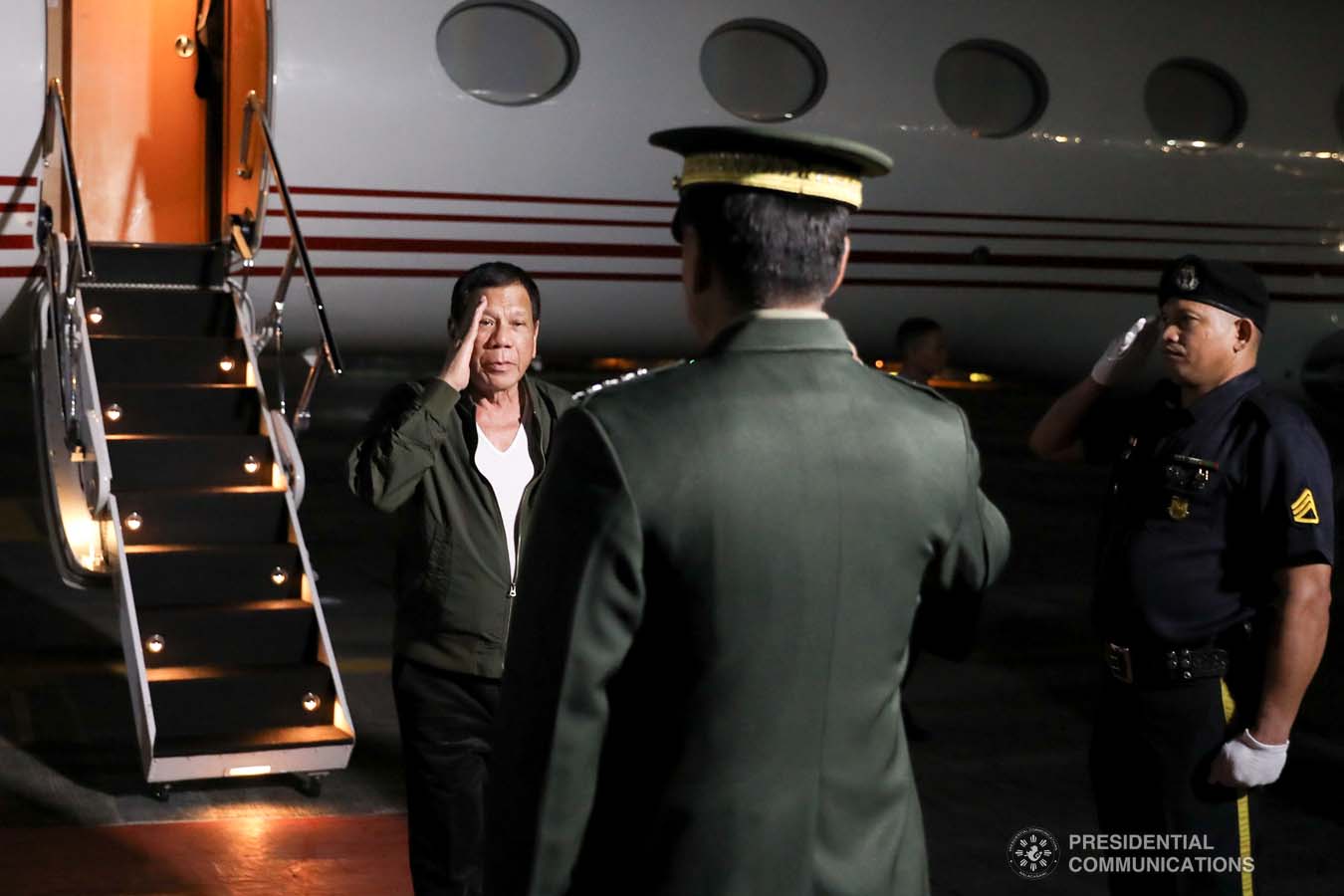 President Rodrigo Roa Duterte salutes a military officer upon his arrival at the Villamor Air Base in Pasay City on November 26, 2019 after his successful participation in the Association of Southeast Asian Nations (ASEAN)-Republic of Korea Commemorative Summit in Busan. ALFRED FRIAS/PRESIDENTIAL PHOTO