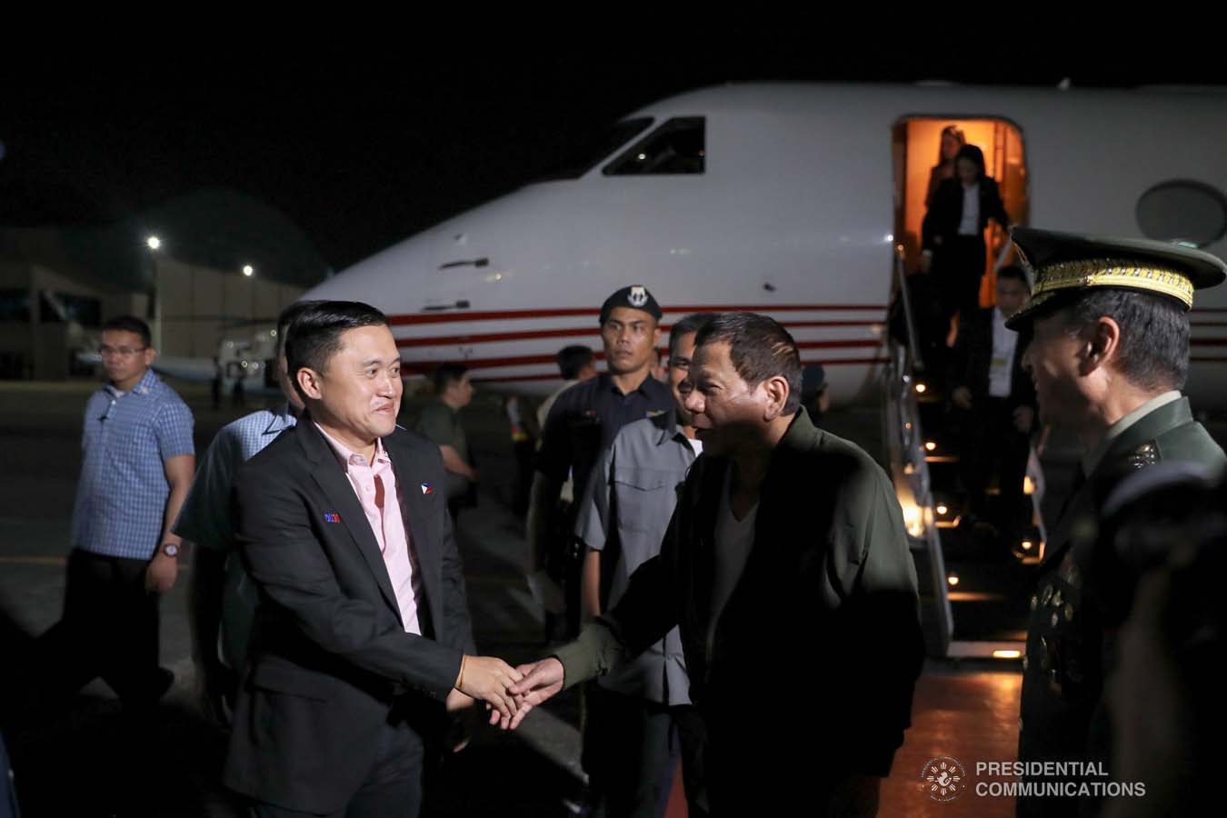 President Rodrigo Roa Duterte is congratulated by Senator Christopher "Bong" Go upon his arrival at the Villamor Air Base in Pasay City on November 26, 2019 after his successful participation in the Association of Southeast Asian Nations (ASEAN)-Republic of Korea Commemorative Summit in Busan. ALFRED FRIAS/PRESIDENTIAL PHOTO