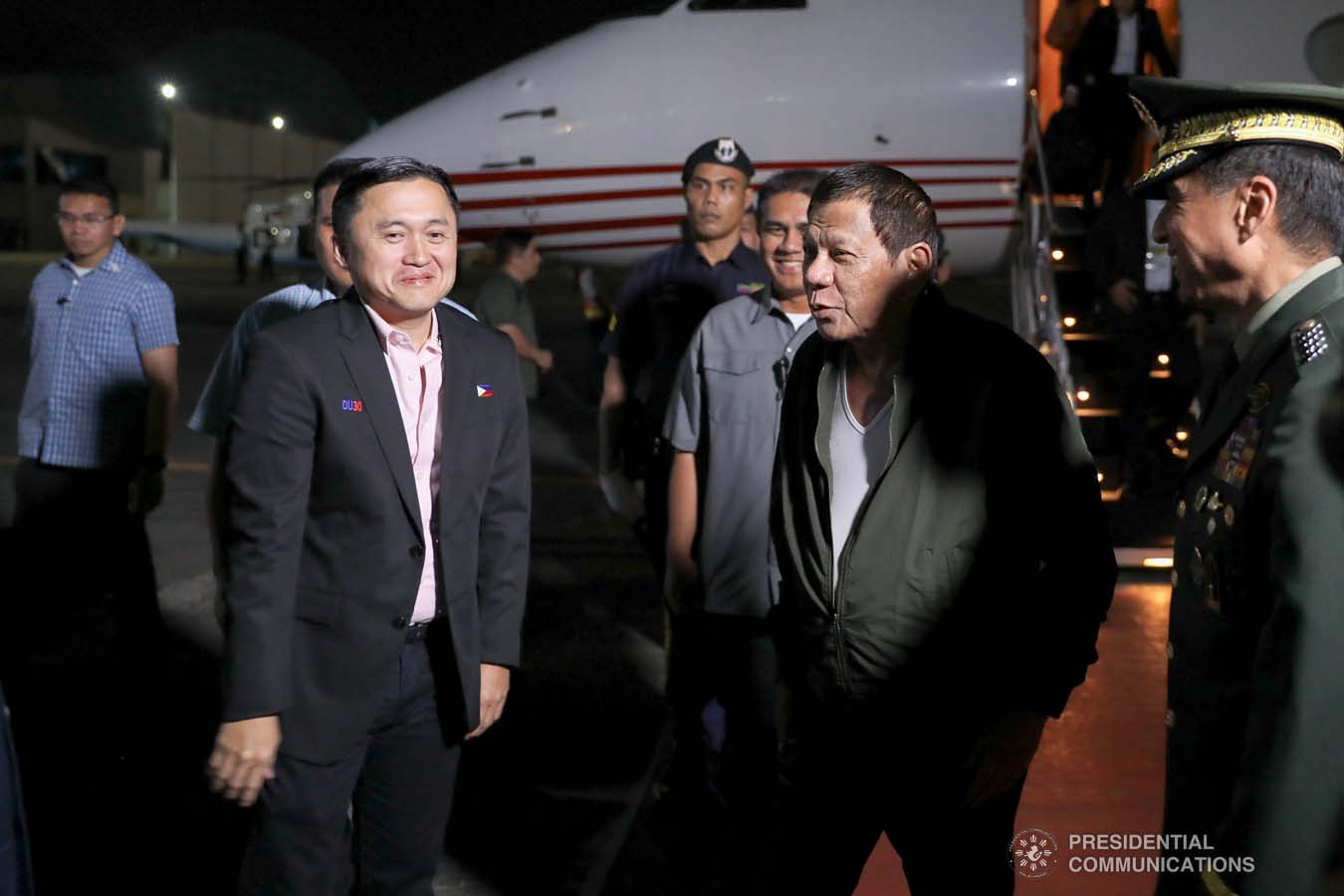 President Rodrigo Roa Duterte shares a light moment with Senator Christopher "Bong" Go upon his arrival at the Villamor Air Base in Pasay City on November 26, 2019 after his successful participation in the Association of Southeast Asian Nations (ASEAN)-Republic of Korea Commemorative Summit in Busan. ALFRED FRIAS/PRESIDENTIAL PHOTO