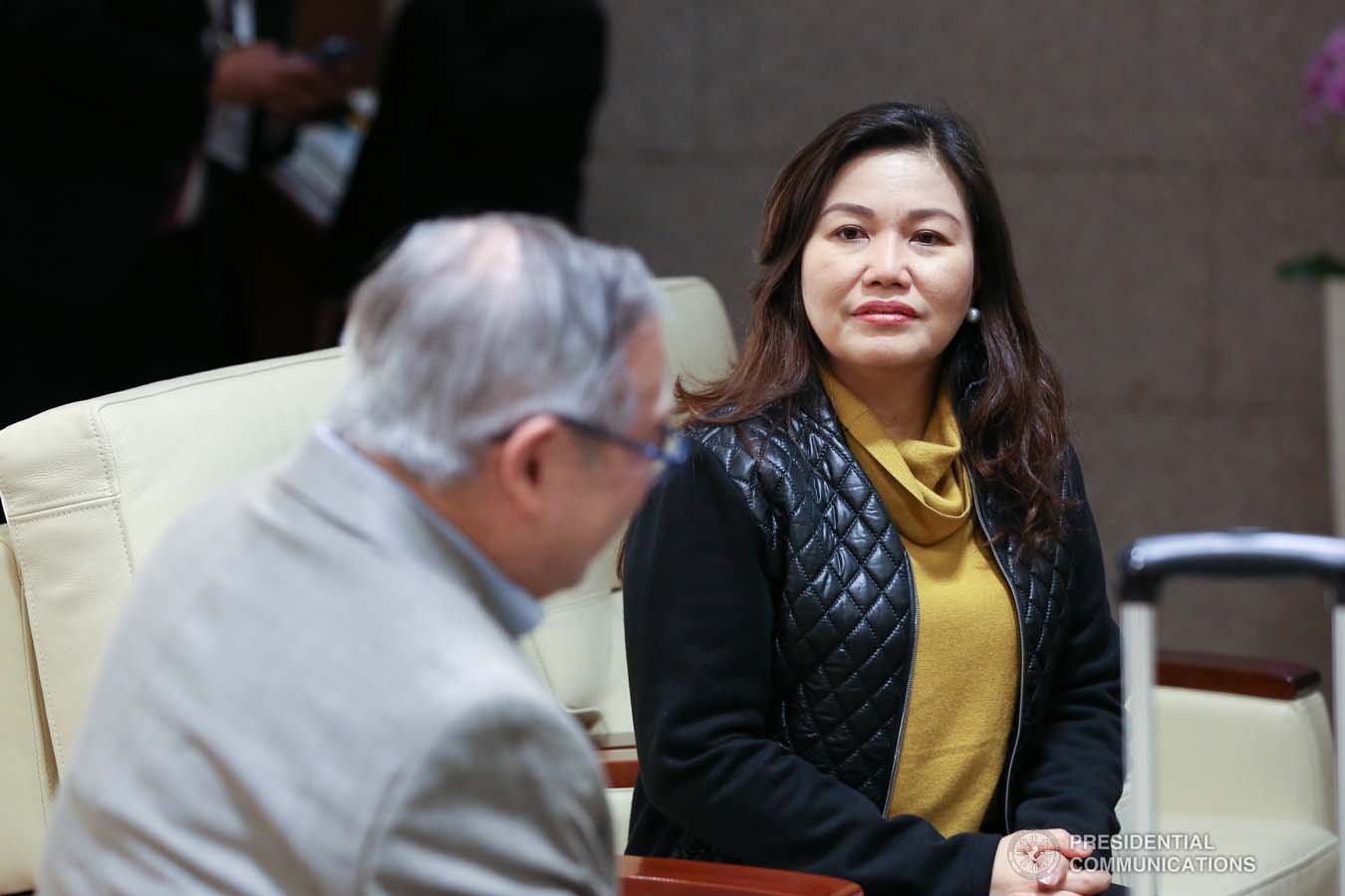 President Rodrigo Roa Duterte's partner Cielito Avanceña chats with Foreign Affairs Secretary Teodoro Locsin Jr. as she prepares to leave for Manila after joining the President in various events during the Association of Southeast Asian Nations (ASEAN)-Republic of Korea Commemorative Summit in Busan on November 26, 2019. RICHARD MADELO/PRESIDENTIAL PHOTO