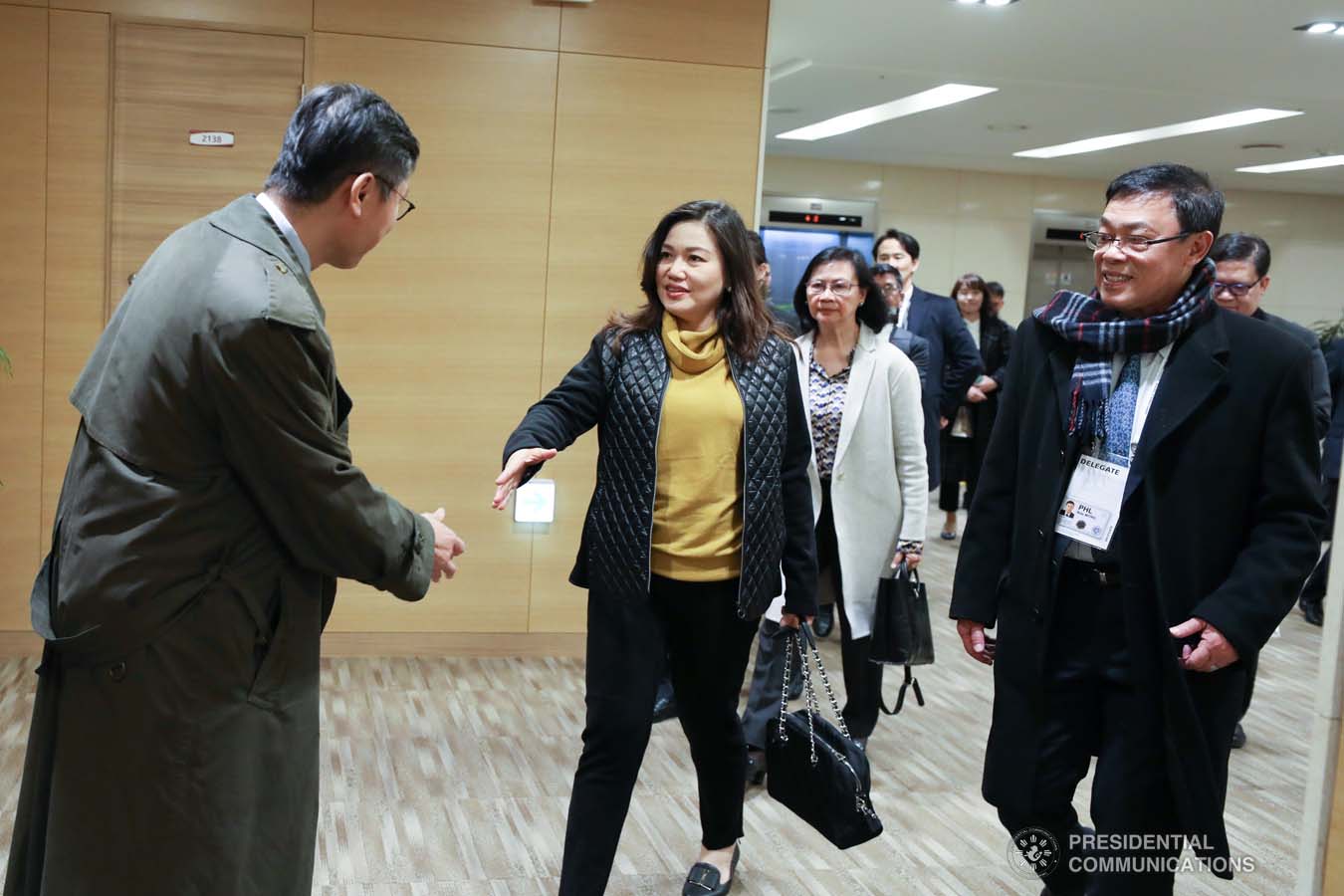 President Rodrigo Roa Duterte's partner Cielito Avanceña bids farewell to a member of the send-off party as she prepares to leave for Manila after joining the President in various events during the Association of Southeast Asian Nations (ASEAN)-Republic of Korea Commemorative Summit in Busan on November 26, 2019. RICHARD MADELO/PRESIDENTIAL PHOTO