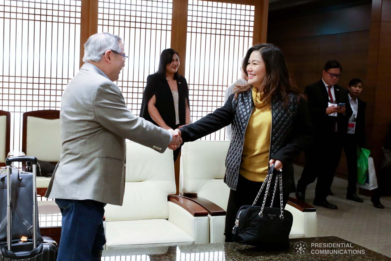 President Rodrigo Roa Duterte's partner Cielito Avanceña bids farewell to Foreign Affairs Secretary Teodoro Locsin Jr. as she prepares to leave for Manila after joining the President in various events during the Association of Southeast Asian Nations (ASEAN)-Republic of Korea Commemorative Summit in Busan on November 26, 2019. RICHARD MADELO/PRESIDENTIAL PHOTO