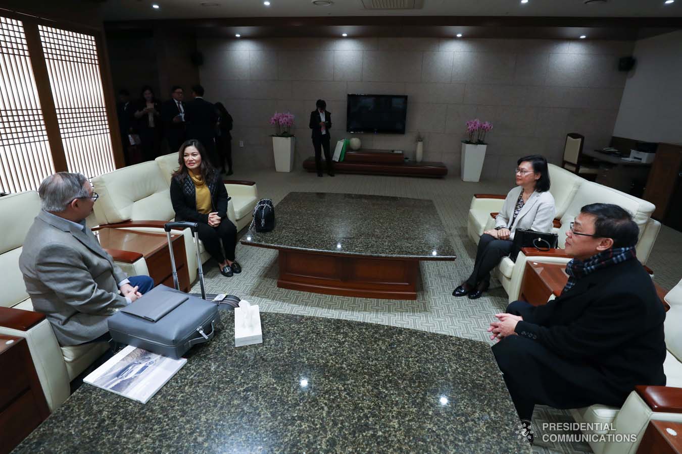 President Rodrigo Roa Duterte's partner Cielito Avanceña chats with Foreign Affairs Secretary Teodoro Locsin Jr. as she prepares to leave for Manila after joining the President in various events during the Association of Southeast Asian Nations (ASEAN)-Republic of Korea Commemorative Summit in Busan on November 26, 2019. RICHARD MADELO/PRESIDENTIAL PHOTO