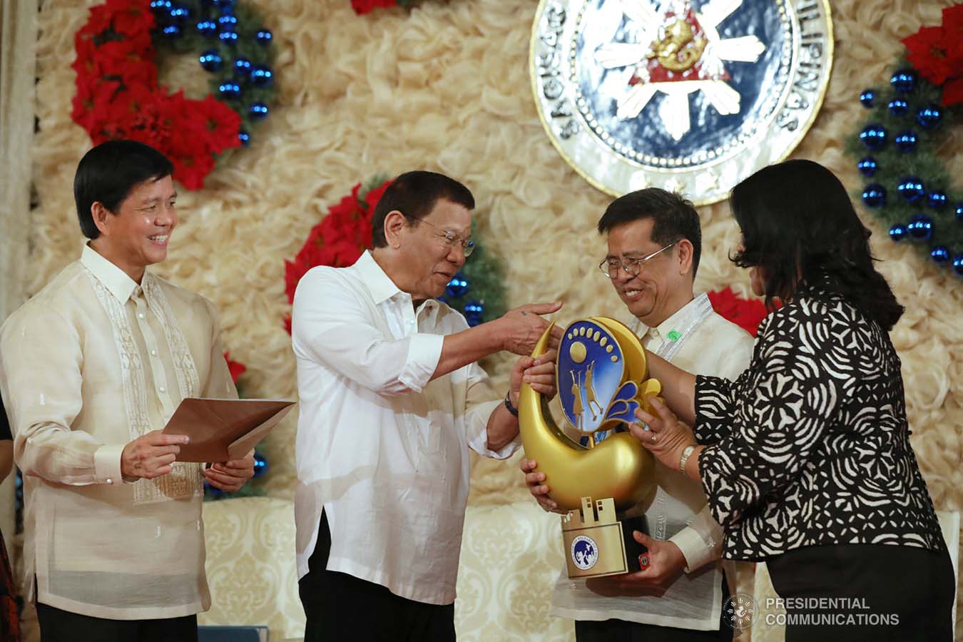 President Rodrigo Roa Duterte leads the awarding ceremony for the 2018 Presidential Award for Child-Friendly Municipalities and Cities (PACFMC) at the Malacañan Palace on November 28, 2019. Assisting the President is Social Welfare and Development Secretary Rolando Bautista. TOTO LOZANO/PRESIDENTIAL PHOTO