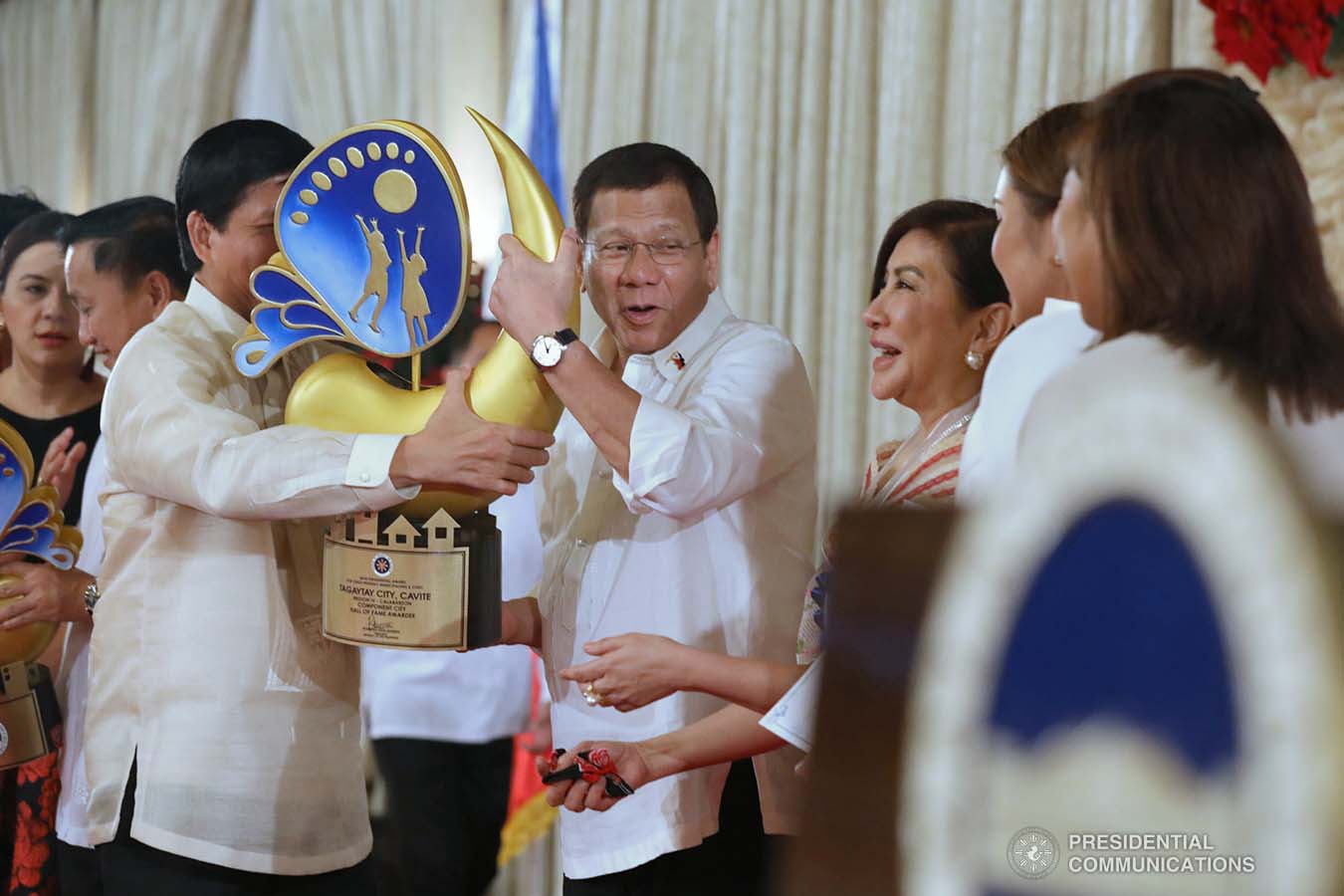 President Rodrigo Roa Duterte leads the awarding ceremony for the 2018 Presidential Award for Child-Friendly Municipalities and Cities (PACFMC) at the Malacañan Palace on November 28, 2019. Assisting the President is Social Welfare and Development Secretary Rolando Bautista. TOTO LOZANO/PRESIDENTIAL PHOTO