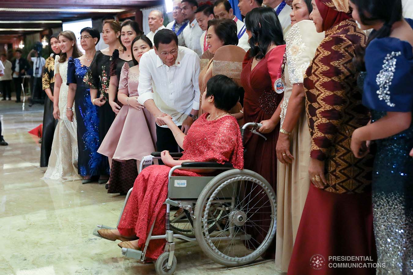 President Rodrigo Roa Duterte greets one of the officials of the Overseas Workers Welfare Administration during the awarding ceremony for the 2019 Model Overseas Filipino Worker (OFW) Family of the Year Award (MOFYA) at the Malacañan Palace on November 28, 2019. TOTO LOZANO/PRESIDENTIAL PHOTO