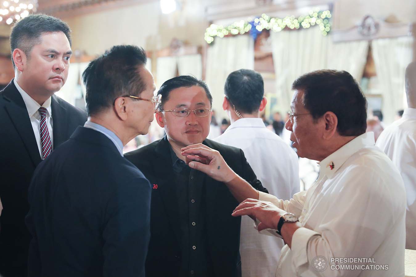 President Rodrigo Roa Duterte discusses matters with Presidential Communications Operations Office Secretary Martin Andanar, Presidential Chief Legal Counsel and Spokesperson Salvador Panelo, and Senator Christopher "Bong" Go after leading the awarding ceremony for the 2019 Model Overseas Filipino Worker (OFW) Family of the Year Award (MOFYA) at the Malacañan Palace on November 28, 2019. VALERIE ESCALERA/PRESIDENTIAL PHOTO