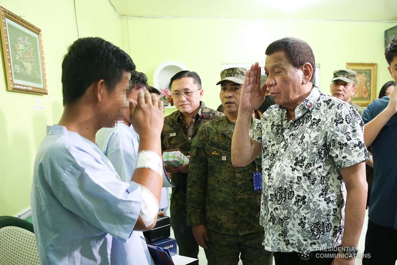 President Rodrigo Roa Duterte salutes one of the wounded soldiers he visited at Camp Lukban Station Hospital Catbalogan City in Samar on November 15, 2019. ALBERT ALCAIN/PRESIDENTIAL PHOTO