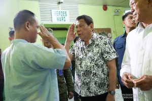 President Rodrigo Roa Duterte salutes one of the wounded soldiers he visited at Camp Lukban Station Hospital Catbalogan City in Samar on November 15, 2019. ALBERT ALCAIN/PRESIDENTIAL PHOTO