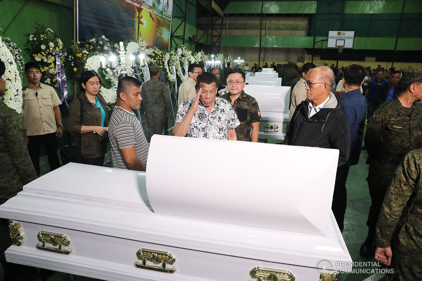 President Rodrigo Roa Duterte pays his last respects to one of the slain soldiers he visited at Camp General Vicente Lukban in Catbalogan City in Samar on November 15, 2019. ALBERT ALCAIN/PRESIDENTIAL PHOTO