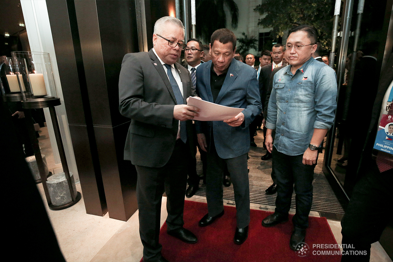 President Rodrigo Roa Duterte is welcomed by Trade and Industry Secretary Ramon Lopez upon his arrival at a hotel in Bangkok, Thailand on November 1, 2019. With the President is Senator Christopher "Bong" Go. ALBERT ALCAIN/PRESIDENTIAL PHOTO