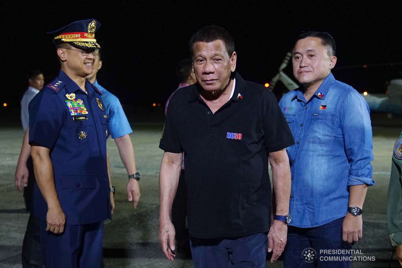 President Rodrigo Roa Duterte prepares to board a plane bound for the Kingdom of Thailand at the Tactical Operations Group 11 in Davao City on November 1, 2019. With the President is Senator Christopher "Bong" Go. JOEY DALUMPINES/PRESIDENTIAL PHOTO