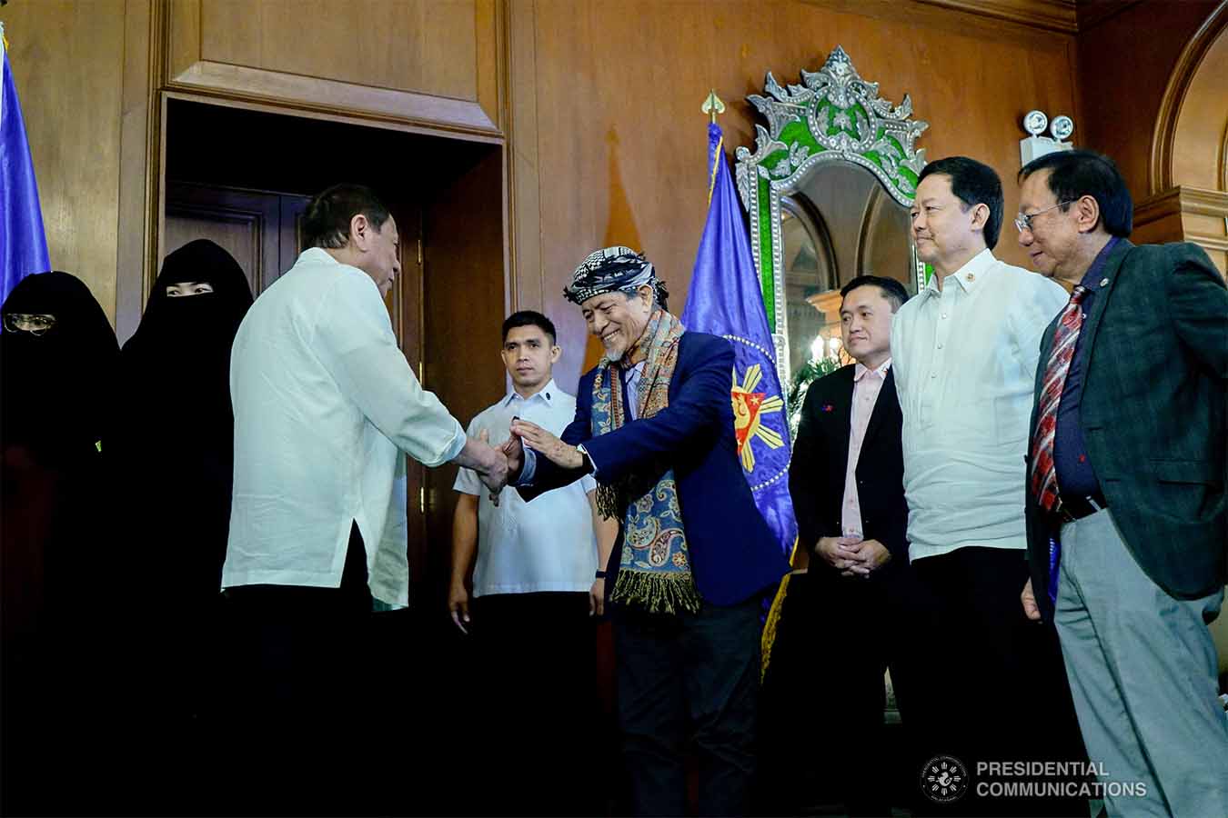 President Rodrigo Roa Duterte gives a warm welcome to Moro National Liberation Front Founding Chairman Nur Misuari at the Malacañan Palace on November 11, 2019. KING RODRIGUEZ/PRESIDENTIAL PHOTO
