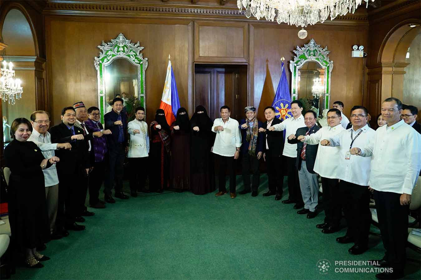 President Rodrigo Roa Duterte strikes his signature pose with Moro National Liberation Front Founding Chairman Nur Misuari following their meeting at the Malacañan Palace on November 11, 2019. KING RODRIGUEZ/PRESIDENTIAL PHOTO