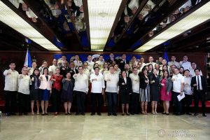 President Rodrigo Roa Duterte strikes his signature pose with the newly-appointed government officials during their oath-taking ceremony at the Malacañan Palace on December 3, 2019. ALBERT ALCAIN/PRESIDENTIAL PHOTO
