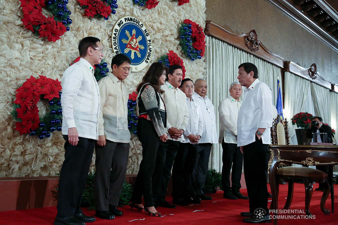 President Rodrigo Roa Duterte discusses matters with Health Secretary Francisco Duque III, Interior and Local Government Secretary Eduardo Año, Senate President Vicente Sotto III, Senator Christopher "Bong" Go and Executive Secretary Salvador Medialdea during the ceremonial signing of the Postponement of the 2020 Barangay and Sangguniang Kabataan Elections Act and the Malasakit Center Act at the Malacañan Palace on December 3, 2019. ALBERT ALCAIN/PRESIDENTIAL PHOTO