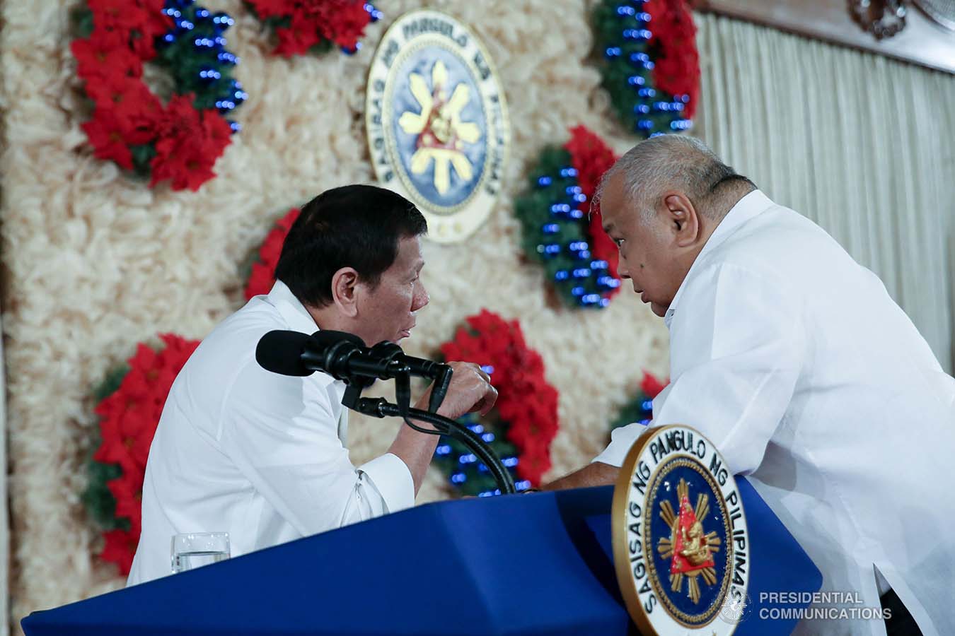 President Rodrigo Roa Duterte discusses matters with Executive Secretary Salvador Medialdea during the ceremonial signing of the Postponement of the 2020 Barangay and Sangguniang Kabataan Elections Act and the Malasakit Center Act at the Malacañan Palace on December 3, 2019. ALBERT ALCAIN/PRESIDENTIAL PHOTO