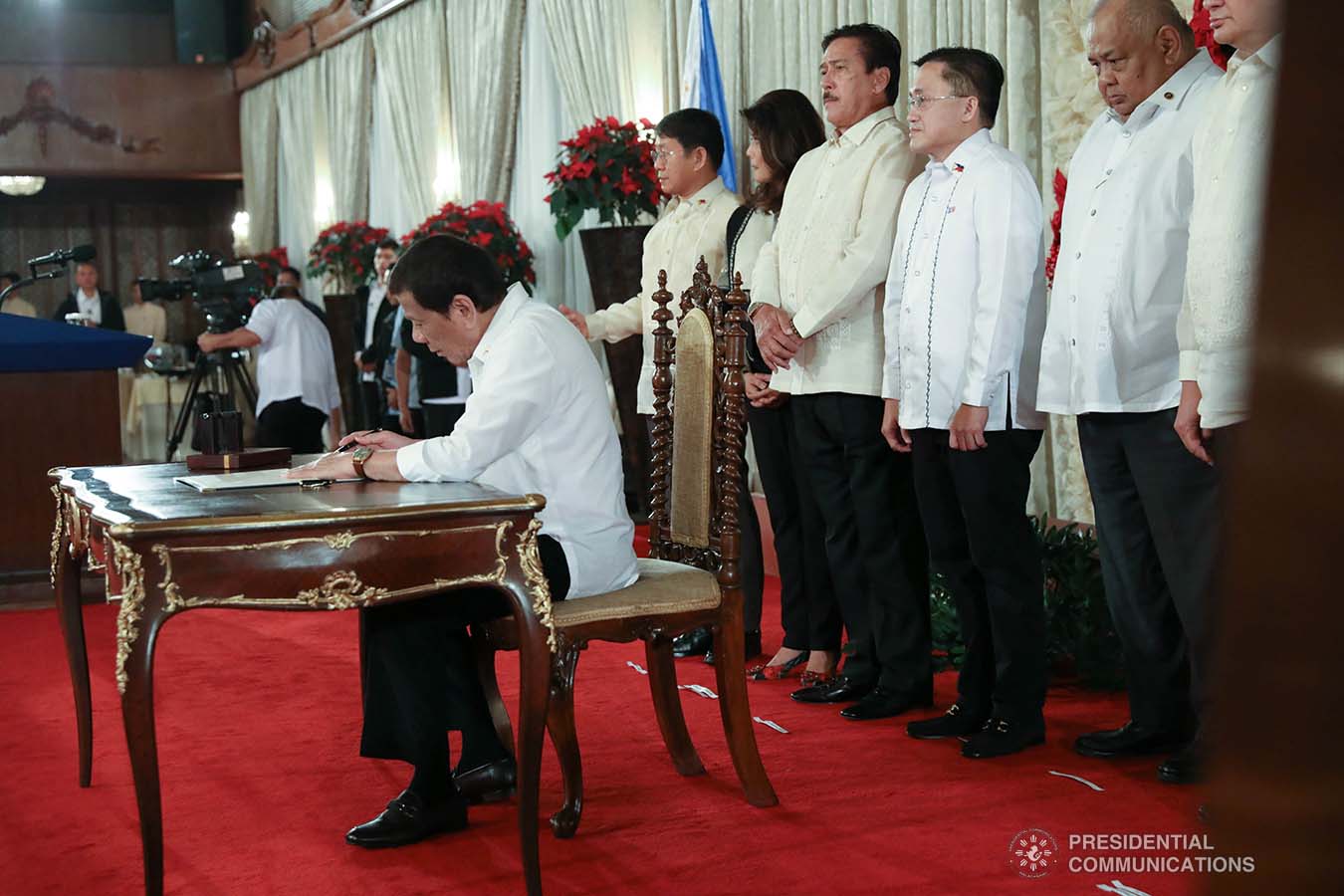 President Rodrigo Roa Duterte signs the Postponement of the 2020 Barangay and Sangguniang Kabataan Elections Act and the Malasakit Center Act during a ceremony at the Malacañan Palace on December 3, 2019. TOTO LOZANO/PRESIDENTIAL PHOTO