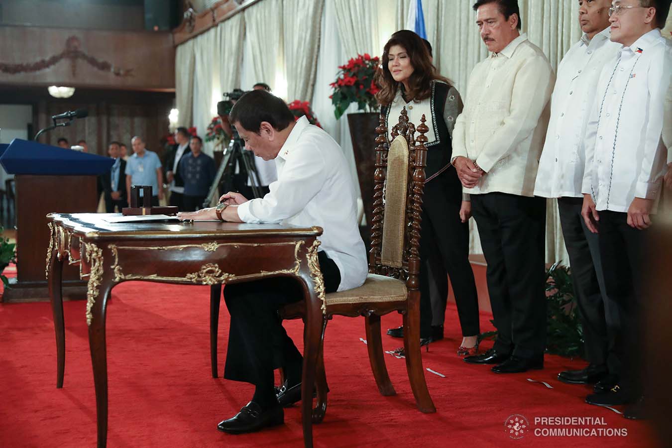 President Rodrigo Roa Duterte signs the Postponement of the 2020 Barangay and Sangguniang Kabataan Elections Act and the Malasakit Center Act during a ceremony at the Malacañan Palace on December 3, 2019. TOTO LOZANO/PRESIDENTIAL PHOTO