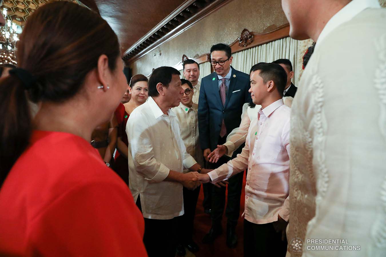 President Rodrigo Roa Duterte greets some members of the House of Representative during the ceremonial signing of the Postponement of the 2020 Barangay and Sangguniang Kabataan Elections Act and the Malasakit Center Act at the Malacañan Palace on December 3, 2019. TOTO LOZANO/PRESIDENTIAL PHOTO