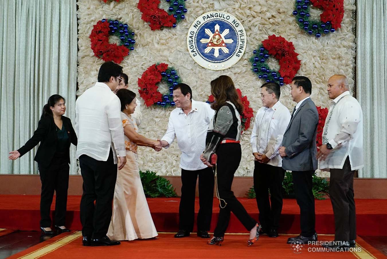 President Rodrigo Roa Duterte greets Senator Cynthia Villar during the ceremonial signing of the Postponement of the 2020 Barangay and Sangguniang Kabataan Elections Act and the Malasakit Center Act at the Malacañan Palace on December 3, 2019. KING RODRIGUEZ/PRESIDENTIAL PHOTO