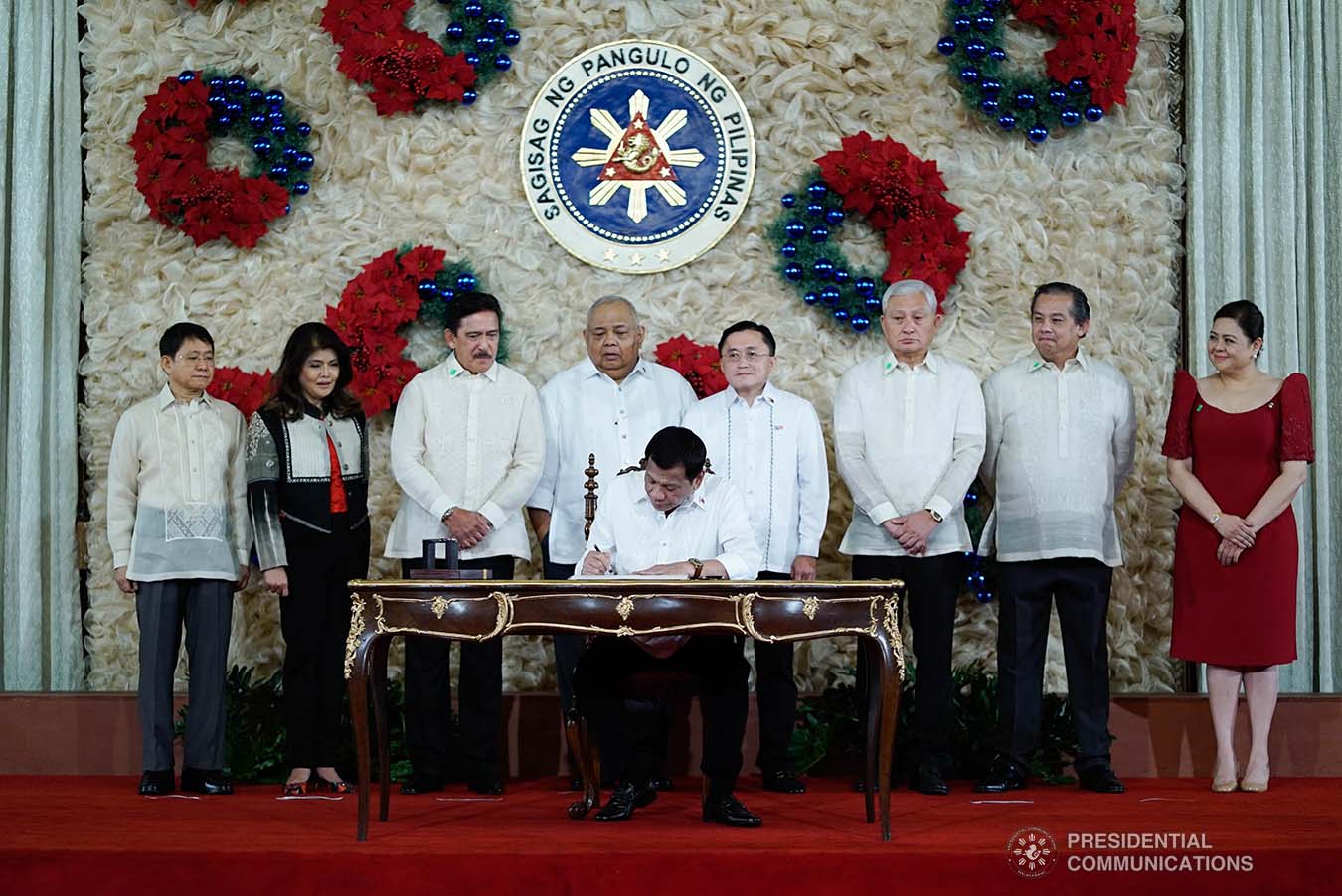 President Rodrigo Roa Duterte signs the Postponement of the 2020 Barangay and Sangguniang Kabataan Elections Act and the Malasakit Center Act during a ceremony at the Malacañan Palace on December 3, 2019. KING RODRIGUEZ/PRESIDENTIAL PHOTO