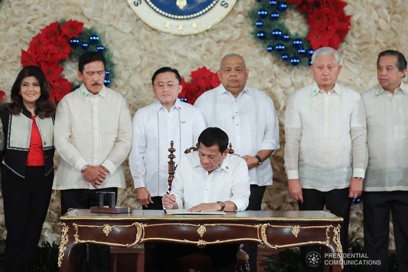 President Rodrigo Roa Duterte signs the Postponement of the 2020 Barangay and Sangguniang Kabataan Elections Act and the Malasakit Center Act during a ceremony at the Malacañan Palace on December 3, 2019. VALERIE ESCALERA/PRESIDENTIAL PHOTO