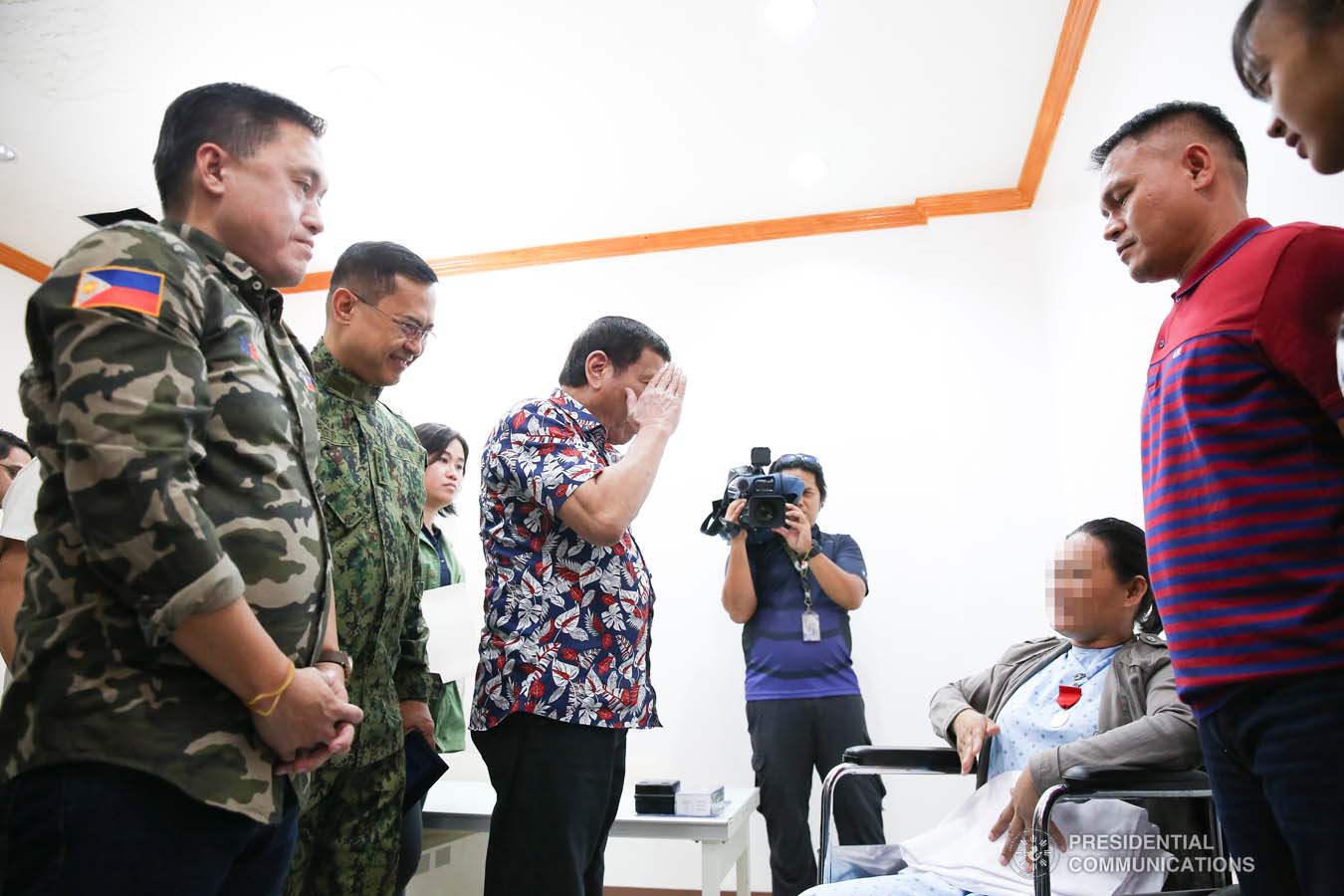 President Rodrigo Roa Duterte salutes a wounded police officer he visited at the Misamis Oriental Provincial Hospital (MOPH) in Initao town on December 5, 2019. ALBERT ALCAIN/PRESIDENTIAL PHOTO