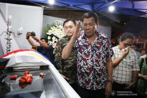 President Rodrigo Roa Duterte pays his last respects to the late Police Senior Master Sergeant Jason Magno as he visits the wake in Initao, Misamis Oriental on December 5, 2019. TOTO LOZANO/PRESIDENTIAL PHOTO