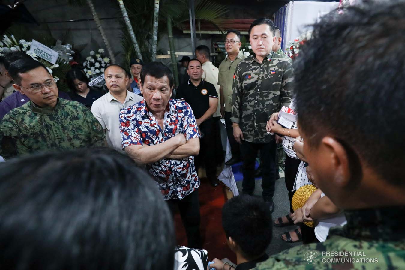 President Rodrigo Roa Duterte condoles with the family of the late Police Senior Master Sergeant Jason Magno as he visits the wake in Initao, Misamis Oriental on December 5, 2019. TOTO LOZANO/PRESIDENTIAL PHOTO