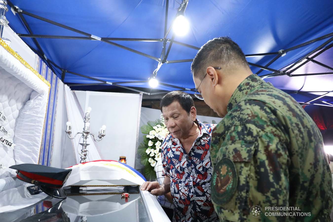 President Rodrigo Roa Duterte pays his last respects to the late Police Senior Master Sergeant Jason Magno as he visits the wake in Initao, Misamis Oriental on December 5, 2019. TOTO LOZANO/PRESIDENTIAL PHOTO