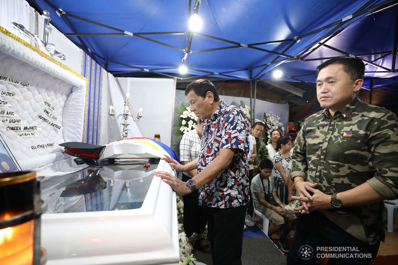 President Rodrigo Roa Duterte pays his last respects to the late Police Senior Master Sergeant Jason Magno as he visits the wake in Initao, Misamis Oriental on December 5, 2019. TOTO LOZANO/PRESIDENTIAL PHOTO
