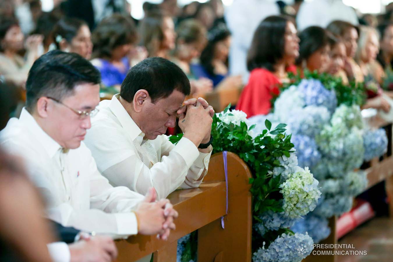 President Rodrigo Roa Duterte kneels in prayer during the wedding of Makkaria and First Lieutenant James Estoesta at the St. Ignatius Chapel in Fort Gen. Gregorio H. del Pilar, Baguio City on December 8, 2019. SIMEON CELI JR./PRESIDENTIAL PHOTO