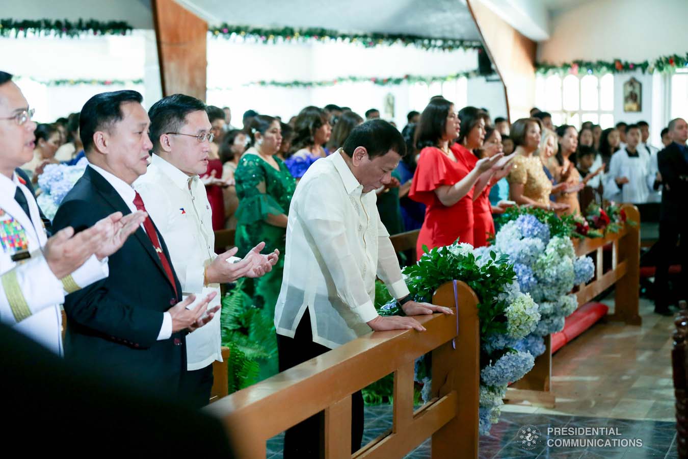 President Rodrigo Roa Duterte bows his head in prayer during the wedding of Makkaria and First Lieutenant James Estoesta at the St. Ignatius Chapel in Fort Gen. Gregorio H. del Pilar, Baguio City on December 8, 2019. SIMEON CELI JR./PRESIDENTIAL PHOTO