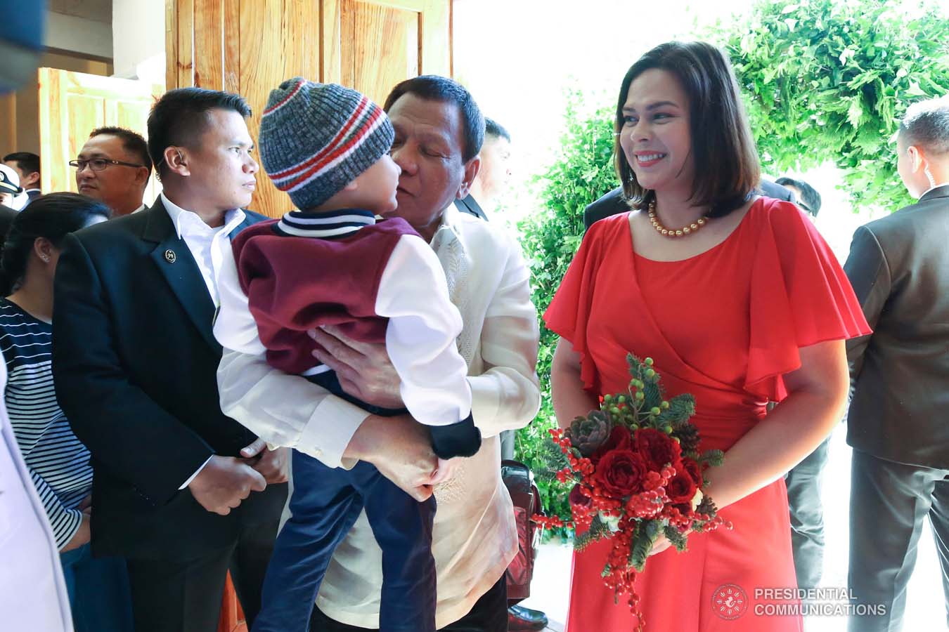 President Rodrigo Roa Duterte shares a light moment with grandson Marko while attending the wedding of Makkaria and First Lieutenant James Estoesta at the St. Ignatius Chapel in Fort Gen. Gregorio H. del Pilar, Baguio City on December 8, 2019. With the President is his daughter Davao City Mayor Sara Duterte-Carpio. RICHARD MADELO/PRESIDENTIAL PHOTO