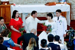 President Rodrigo Roa Duterte greets newlyweds Makkaria and First Lieutenant James Estoesta during the wedding at the St. Ignatius Chapel in Fort Gen. Gregorio H. del Pilar, Baguio City on December 8, 2019. RICHARD MADELO/PRESIDENTIAL PHOTO