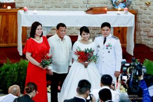 President Rodrigo Roa Duterte and his daughter Davao City Mayor Sara Duterte-Carpio pose for posterity with newlyweds Makkaria and First Lieutenant James Estoesta during the wedding at the St. Ignatius Chapel in Fort Gen. Gregorio H. del Pilar, Baguio City on December 8, 2019. RICHARD MADELO/PRESIDENTIAL PHOTO