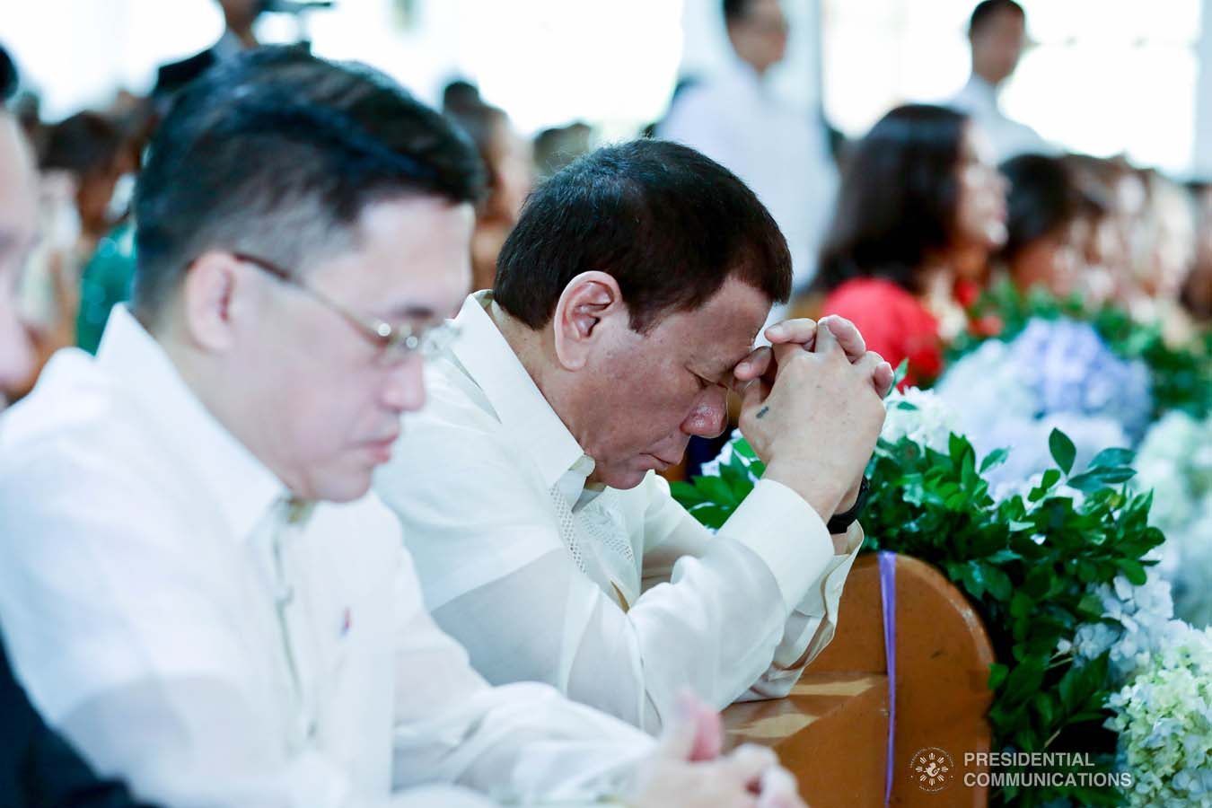 President Rodrigo Roa Duterte kneels in prayer during the wedding of Makkaria and First Lieutenant James Estoesta at the St. Ignatius Chapel in Fort Gen. Gregorio H. del Pilar, Baguio City on December 8, 2019. SIMEON CELI JR./PRESIDENTIAL PHOTO
